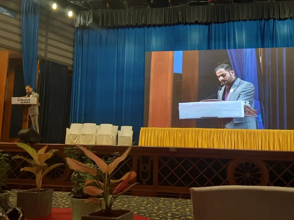 Abhishek speaking at a school seminar.